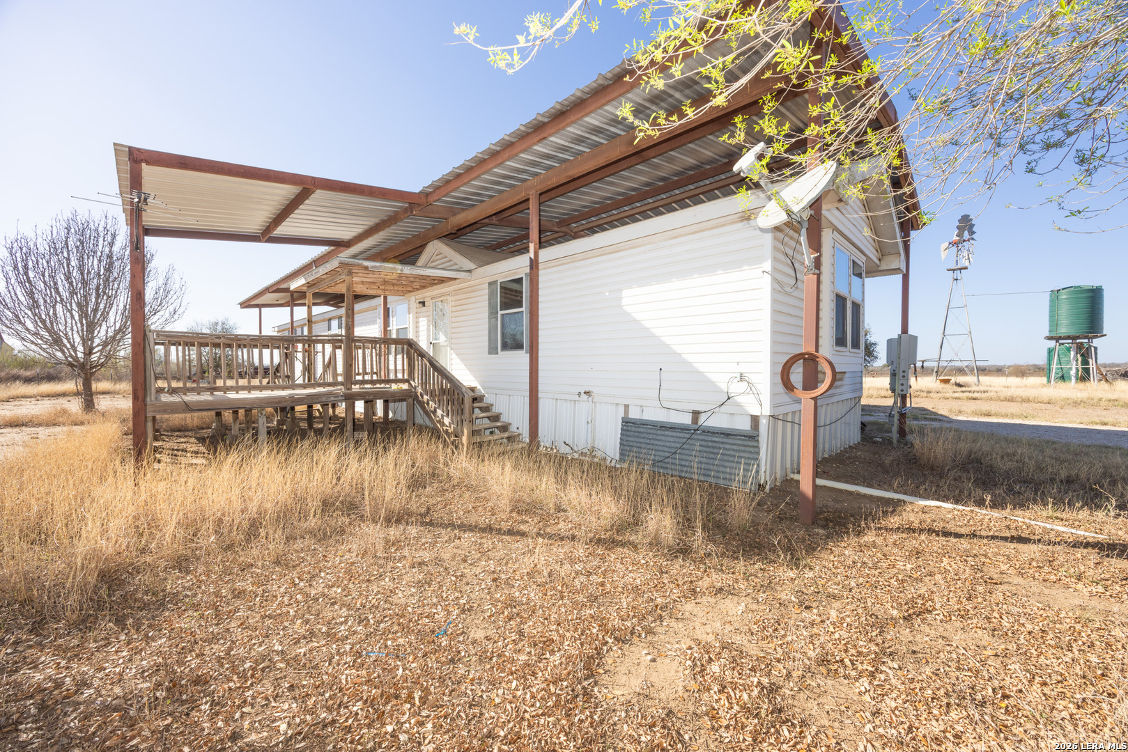 4919 County Road 545 Devine, TX 78016 - Photo 22 of 38 a view of a backyard of a house