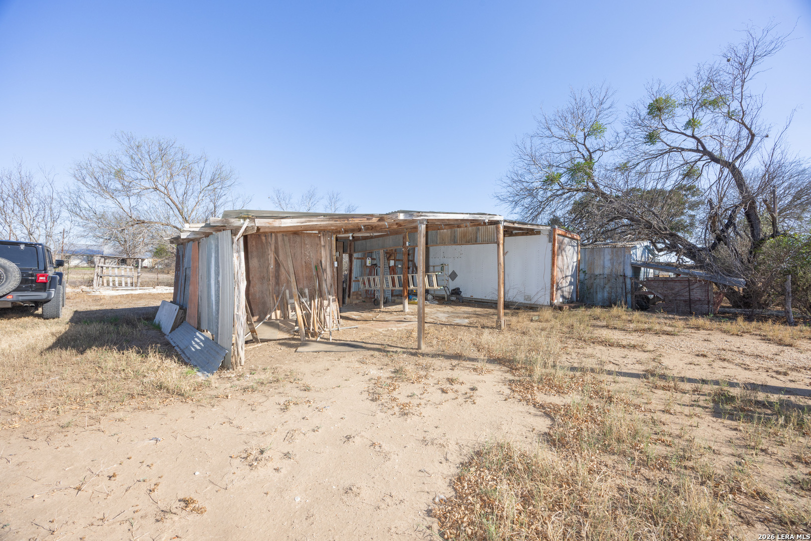 4919 County Road 545 Devine, TX 78016 - Photo 23 of 38 a view of a house with a snow in the yard