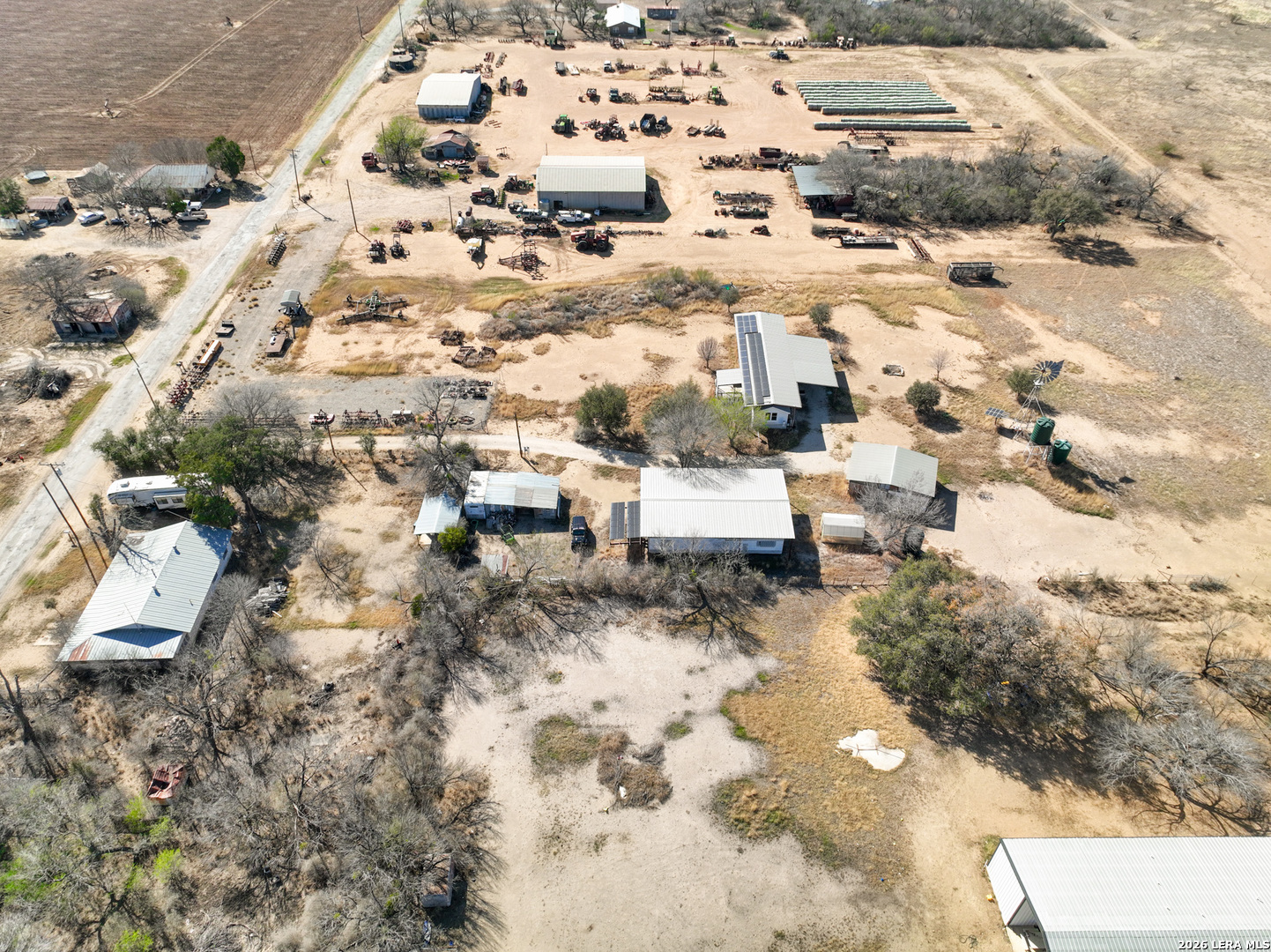4919 County Road 545 Devine, TX 78016 - Photo 26 of 38 an aerial view of residential house with yard