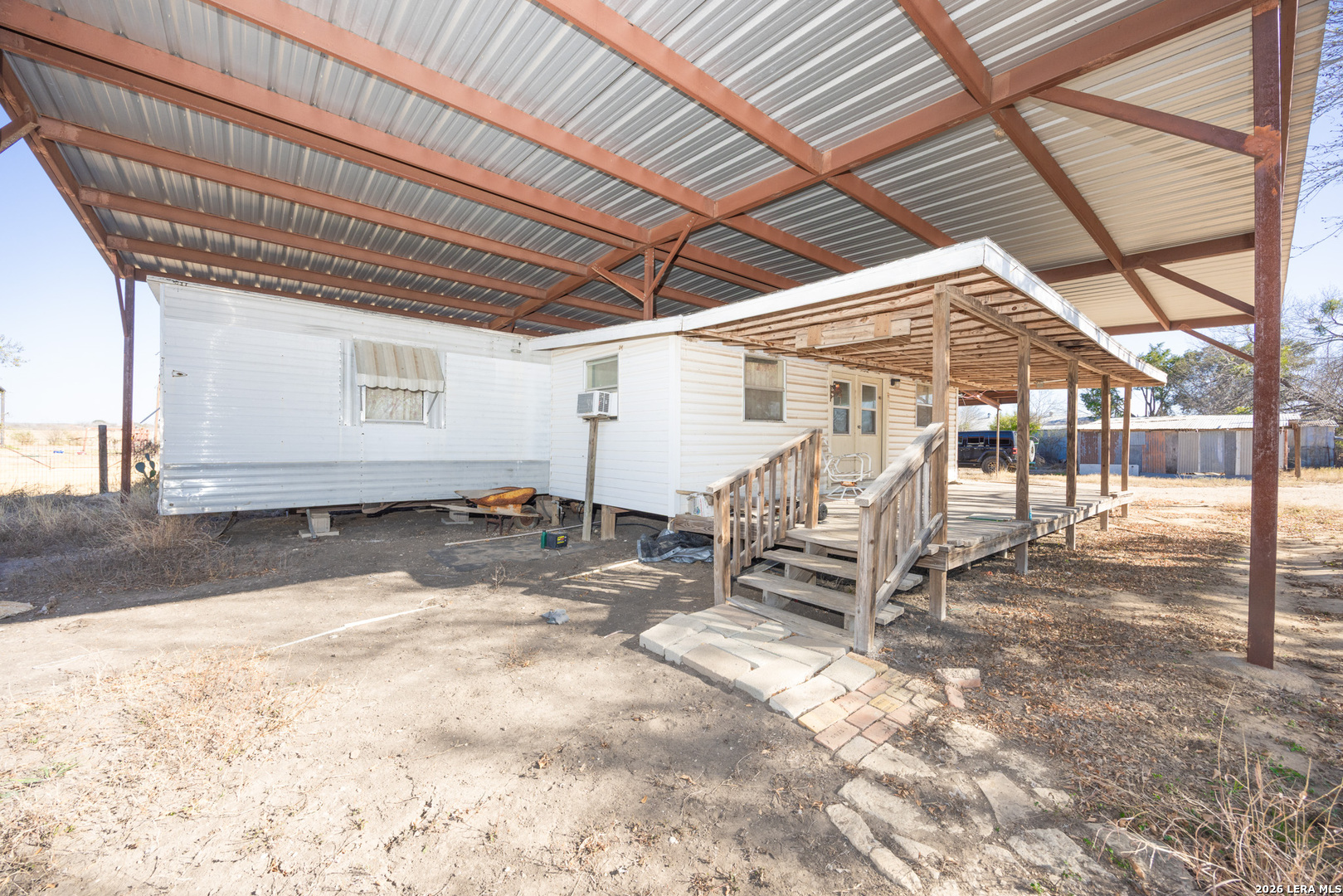 4919 County Road 545 Devine, TX 78016 - Photo 3 of 38 a view of a bike garage