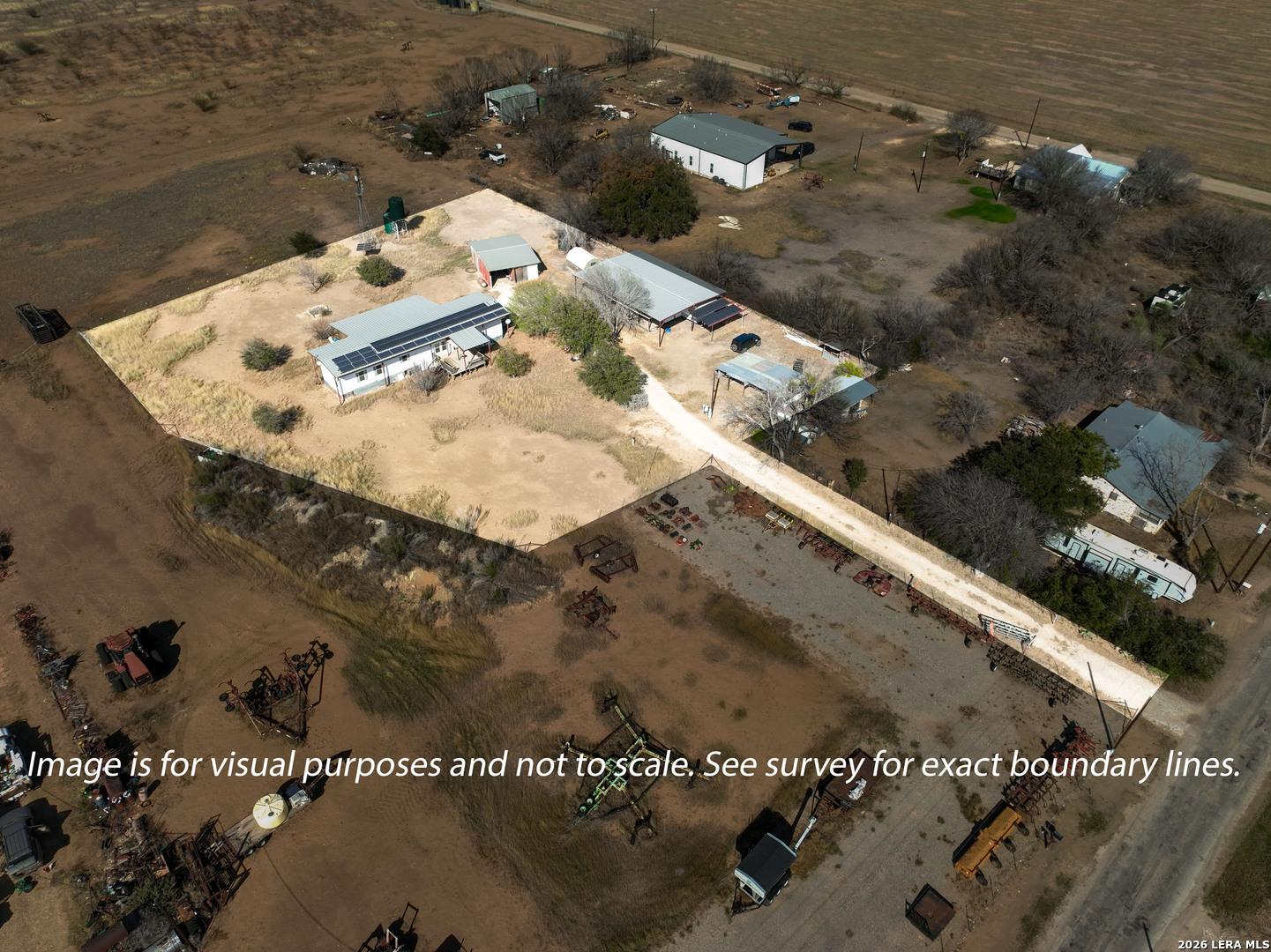 4919 County Road 545 Devine, TX 78016 - Photo 32 of 38 an aerial view of a house