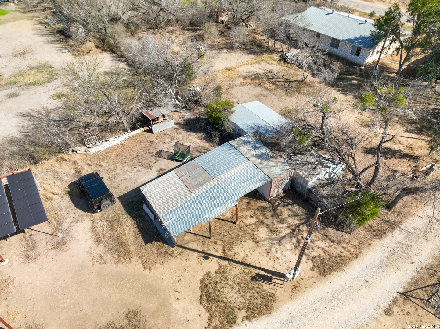 4919 County Road 545 Devine, TX 78016 - Photo 33 of 38 a view of a backyard of the house