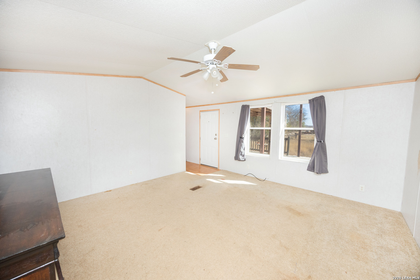 4919 County Road 545 Devine, TX 78016 - Photo 6 of 38 a view of an empty room with a window