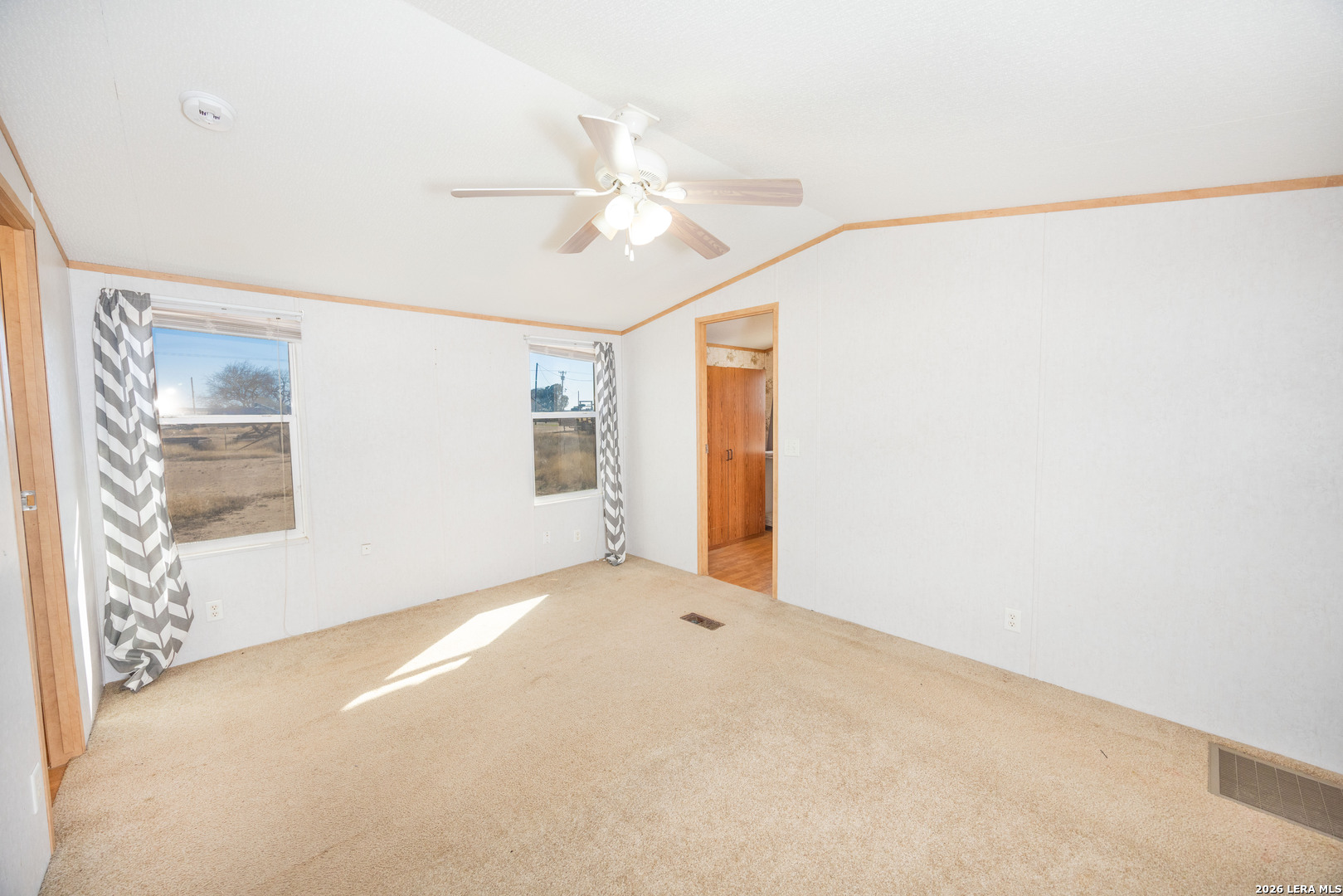 4919 County Road 545 Devine, TX 78016 - Photo 8 of 38 a view of an empty room with a window