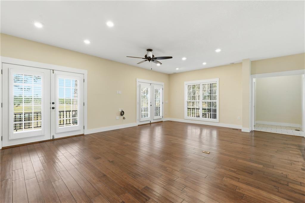 1261 Otter Slide Loop Townsend, GA 31331 - Photo 14 of 52 a view of an empty room with wooden floor and a window