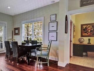 1261 Otter Slide Loop Townsend, GA 31331 - Photo 15 of 52 a view of a dining room with furniture window and wooden floor