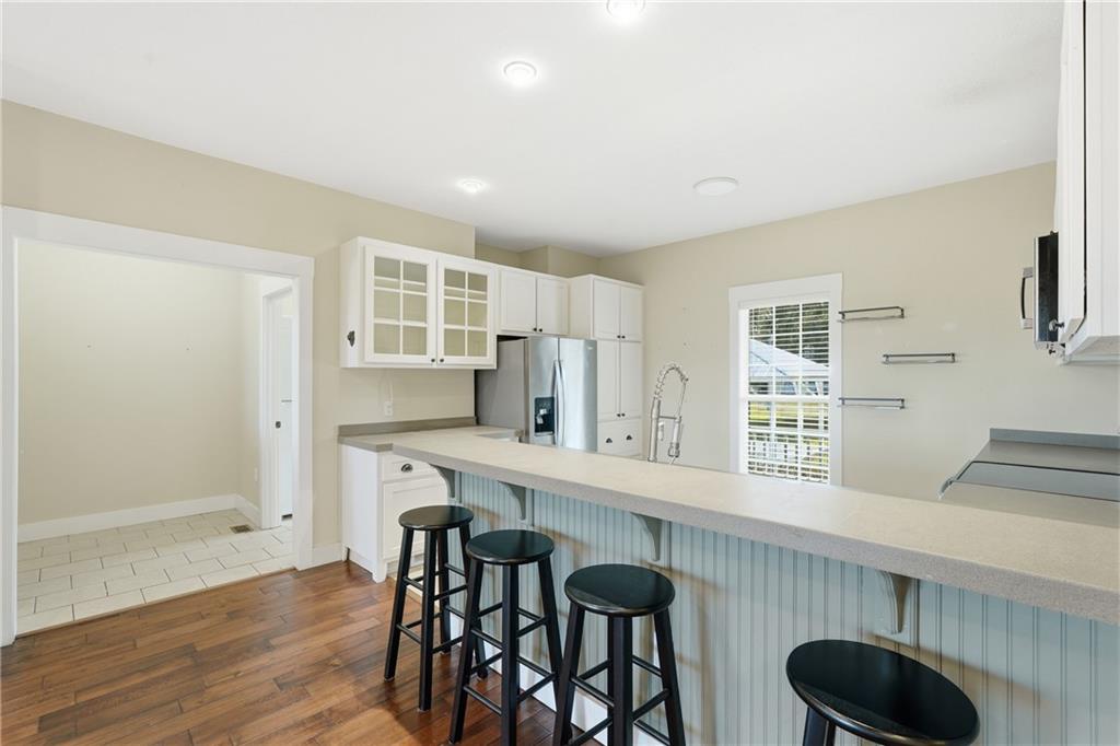 1261 Otter Slide Loop Townsend, GA 31331 - Photo 20 of 52 a kitchen with a table and chairs in it