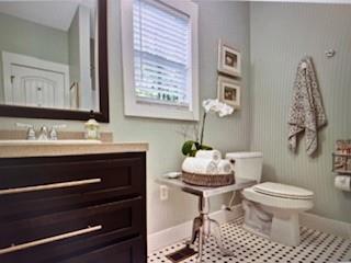 1261 Otter Slide Loop Townsend, GA 31331 - Photo 33 of 52 a bathroom with a sink toilet and a mirror