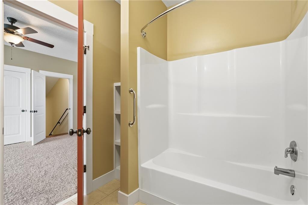 1261 Otter Slide Loop Townsend, GA 31331 - Photo 39 of 52 a bathroom with a bathtub and a shower