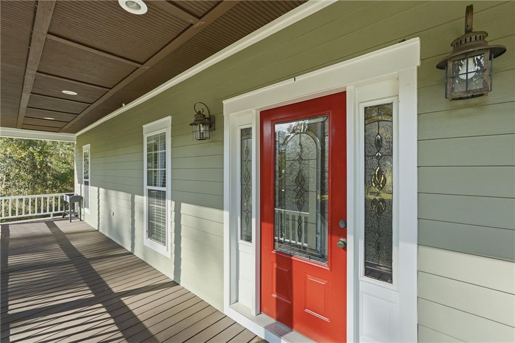 1261 Otter Slide Loop Townsend, GA 31331 - Photo 8 of 52 a view of a porch with wooden floor and windows