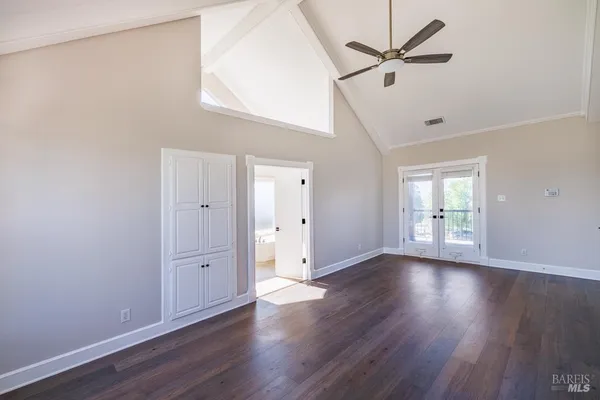 a view of walk in closet with empty racks