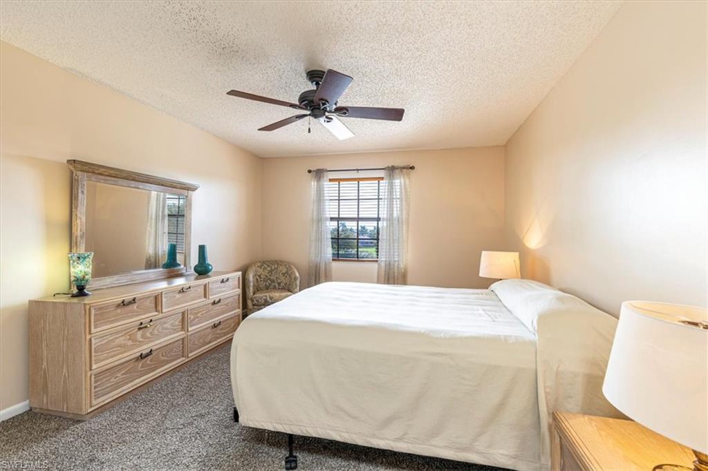 5535 Rattlesnake Hammock Road, Unit 302 Naples, FL 34113 - Photo 11 of 24 a bedroom with a bed and a window