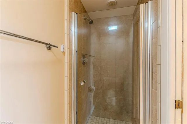 a bathroom with a glass door shower