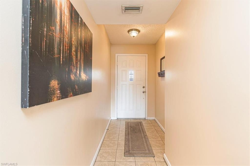 5535 Rattlesnake Hammock Road, Unit 302 Naples, FL 34113 - Photo 21 of 24 a view of a hallway