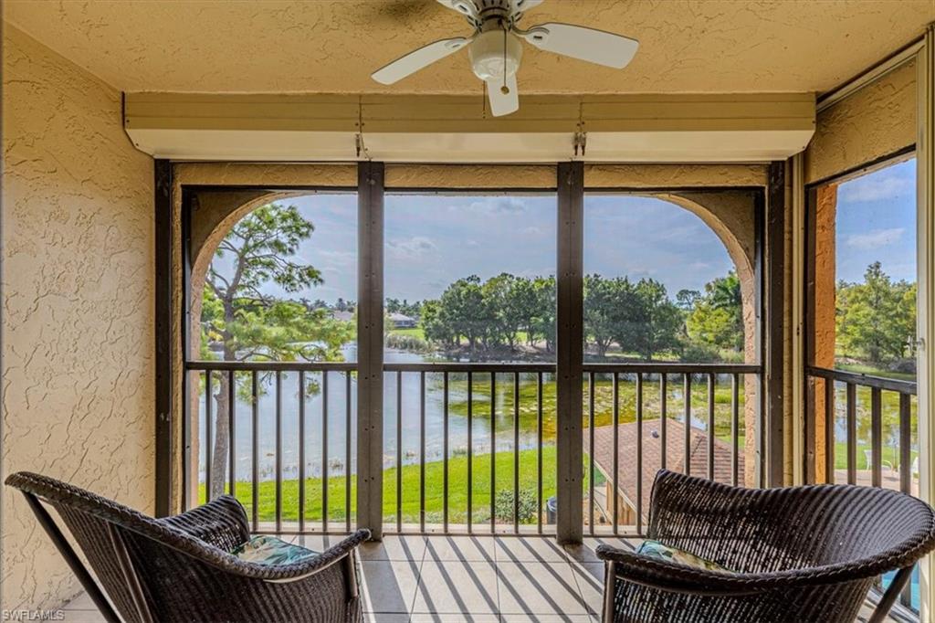 5535 Rattlesnake Hammock Road, Unit 302 Naples, FL 34113 - Photo 24 of 24 a balcony with table and chairs