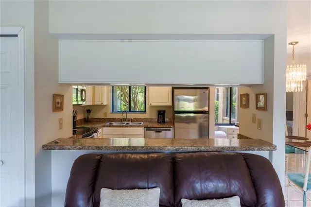 a dining table with chairs and window