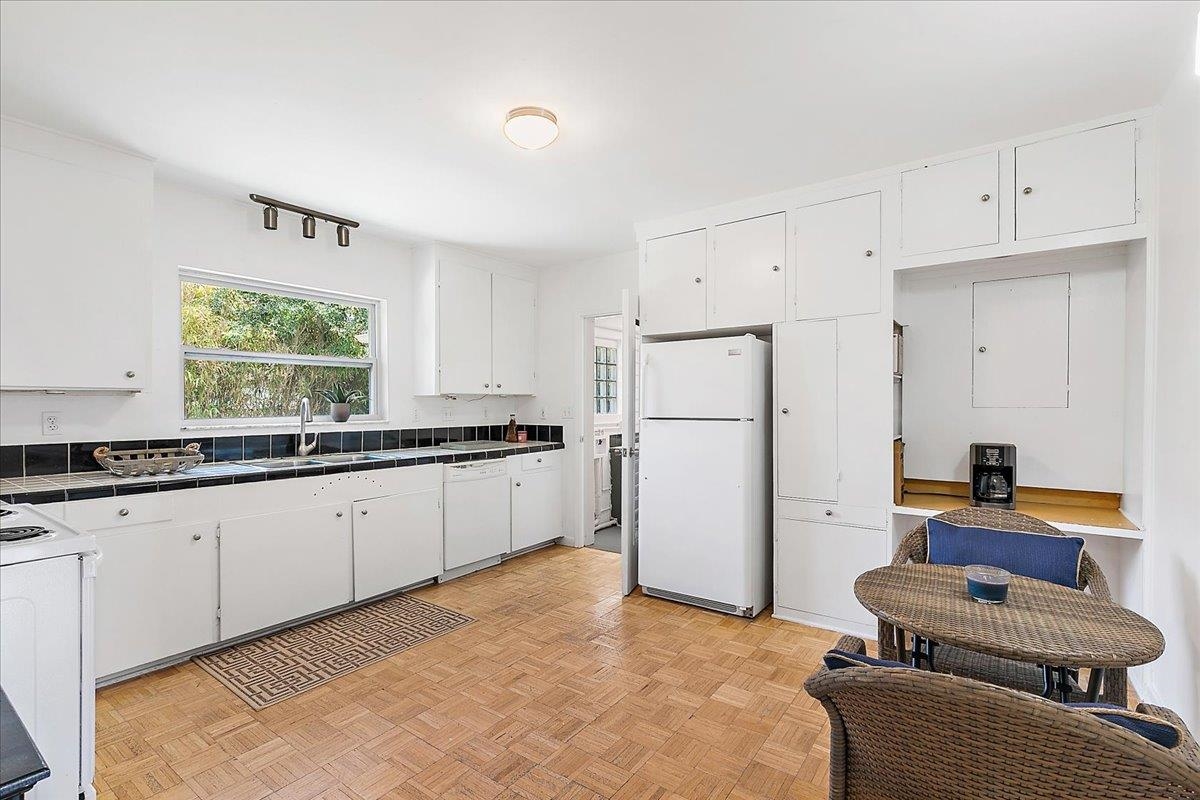 108 Ferrol Road St. Augustine, FL 32084 - Photo 12 of 39 a kitchen with granite countertop a refrigerator and a sink