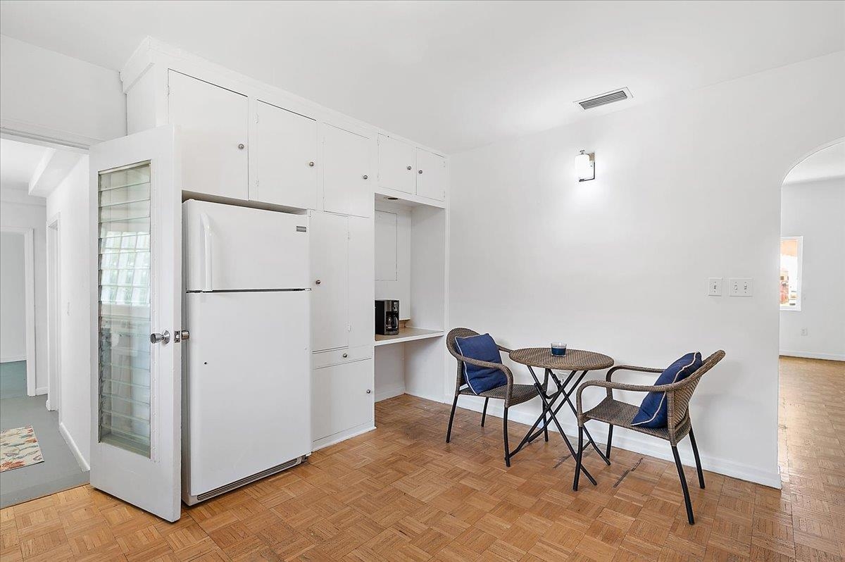 108 Ferrol Road St. Augustine, FL 32084 - Photo 14 of 39 a view of a kitchen with refrigerator and wooden cabinets