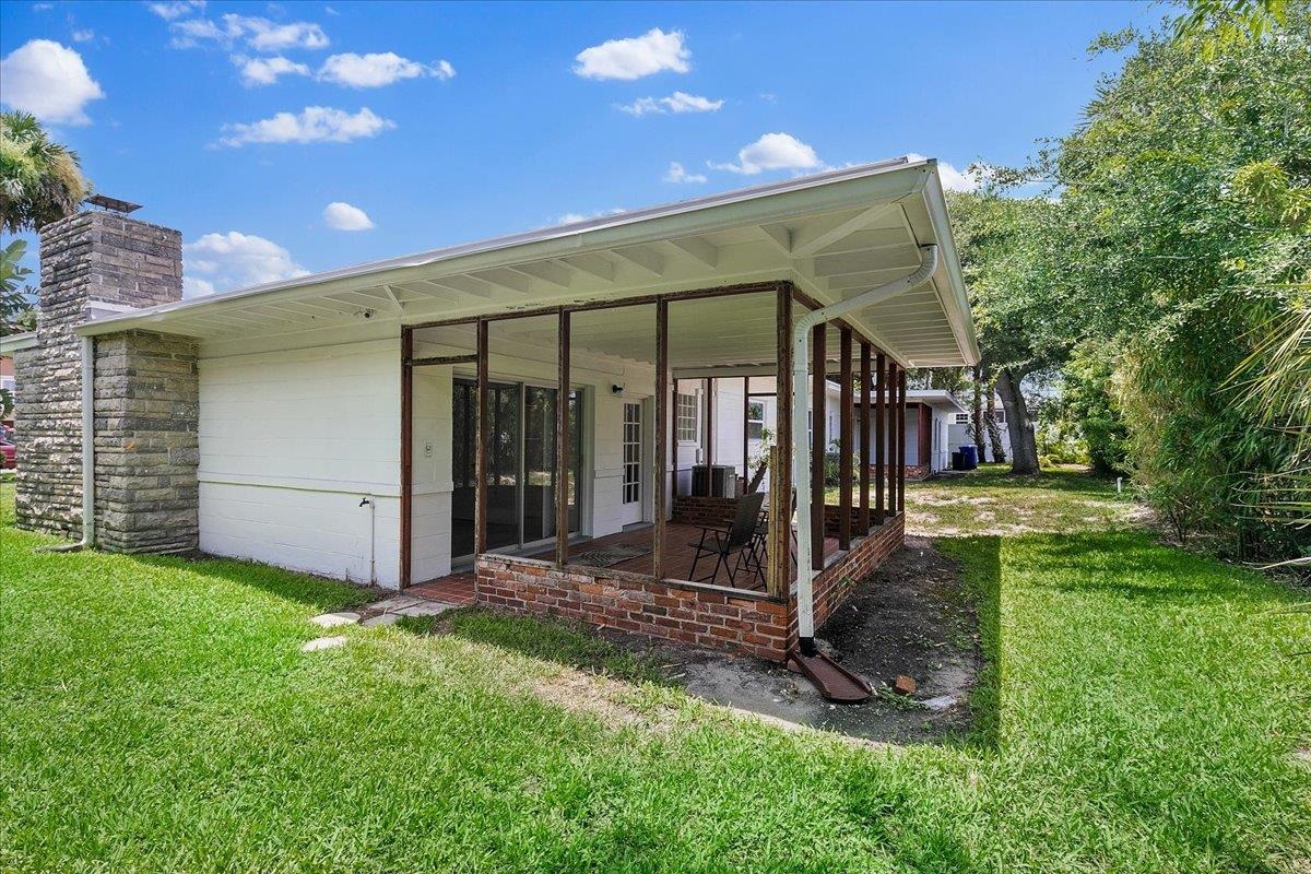 108 Ferrol Road St. Augustine, FL 32084 - Photo 33 of 39 a view of a house with backyard and porch