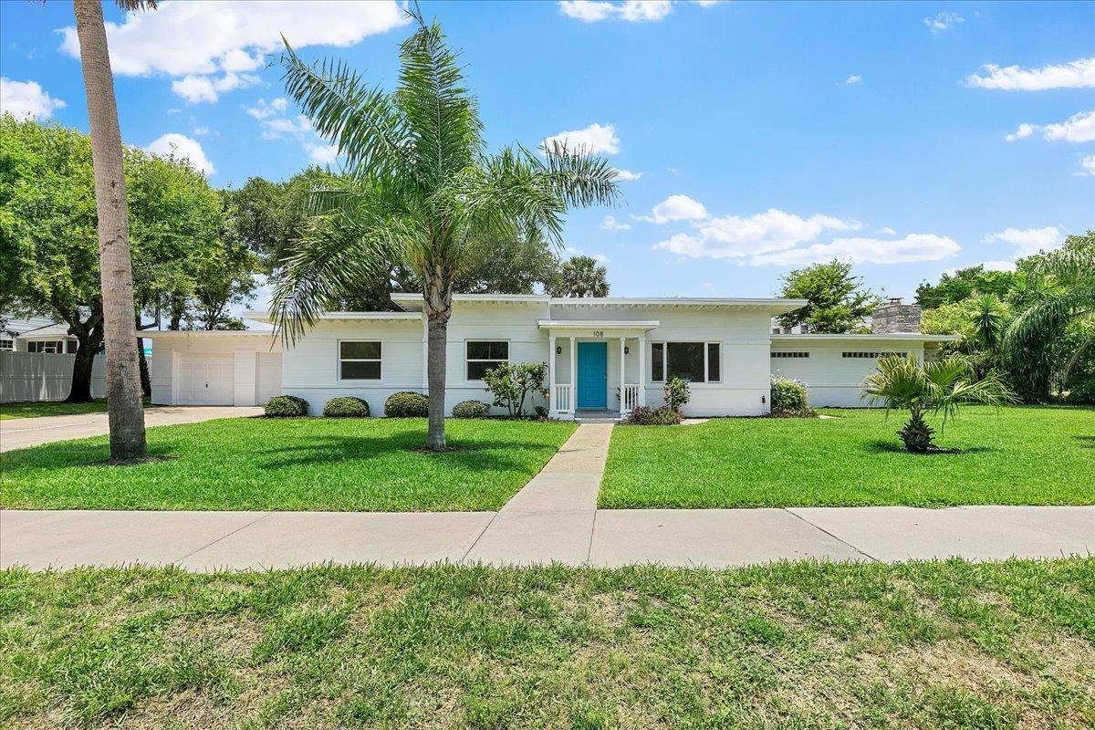 108 Ferrol Road St. Augustine, FL 32084 - Photo 6 of 39 a front view of a house with a yard and trees