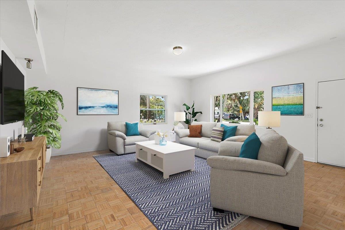 108 Ferrol Road St. Augustine, FL 32084 - Photo 9 of 39 a living room with furniture and a flat screen tv