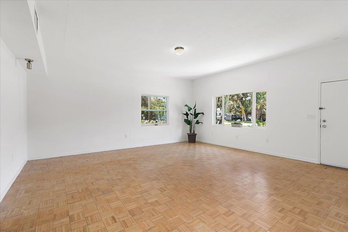 108 Ferrol Road St. Augustine, FL 32084 - Photo 10 of 39 an empty room with windows and mirror