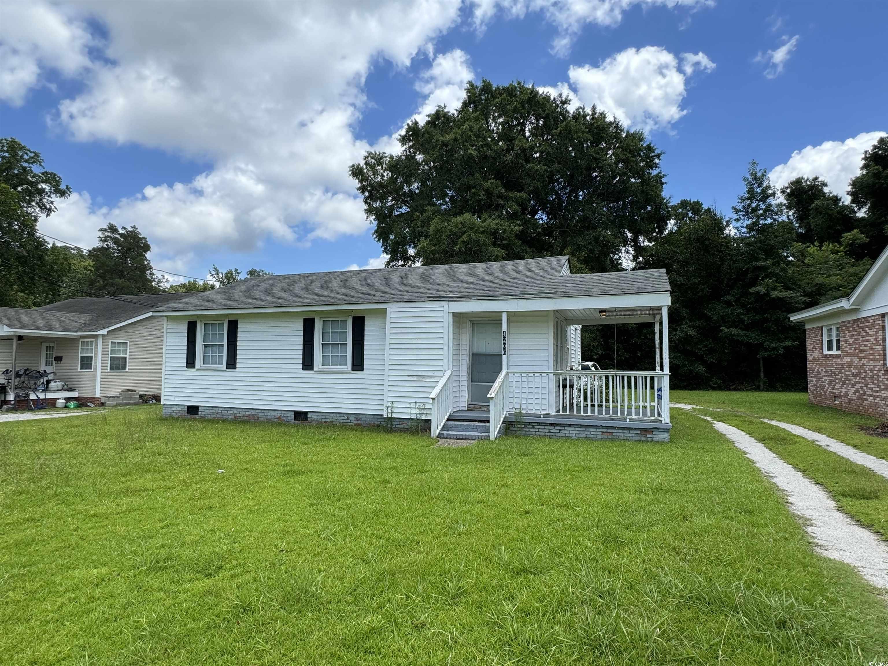 4206 Stevens Street Loris, SC 29569 - Photo 8 of 10 View of front of house featuring crawl space, a front yard, covered porch, and roof with shingles