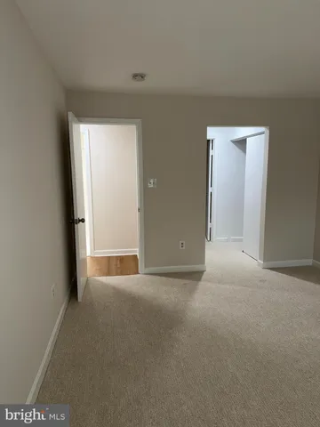 a bathroom with a toilet and a bath tub