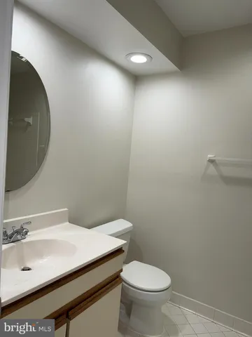 a bathroom with a glass shower door and a toilet
