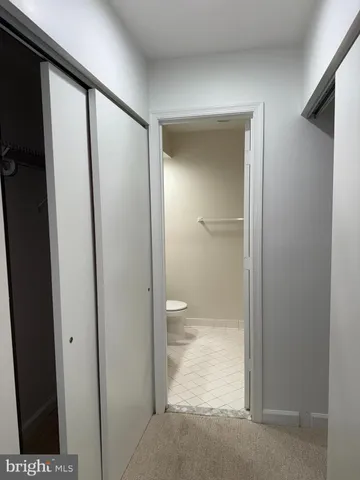 a bathroom with a bath tub with a shower