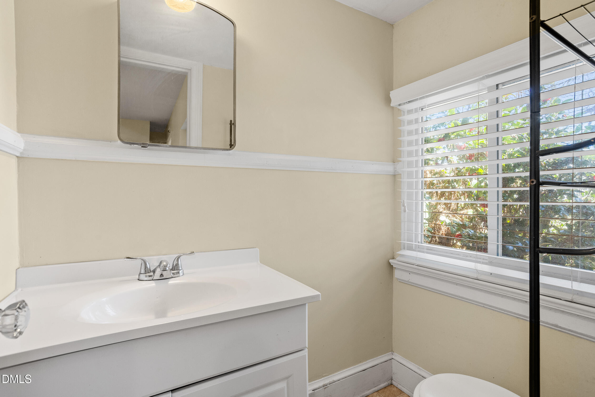 5011 Old Stage Road Raleigh, NC 27603 - Photo 20 of 29 a bathroom with a sink and a mirror