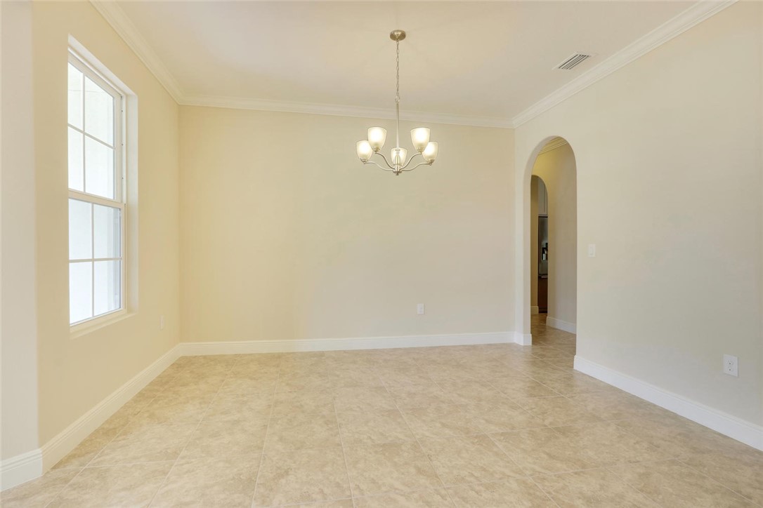 14 52nd Square Vero Beach, FL 32968 - Photo 3 of 25 a view of a chandelier in big room and a window
