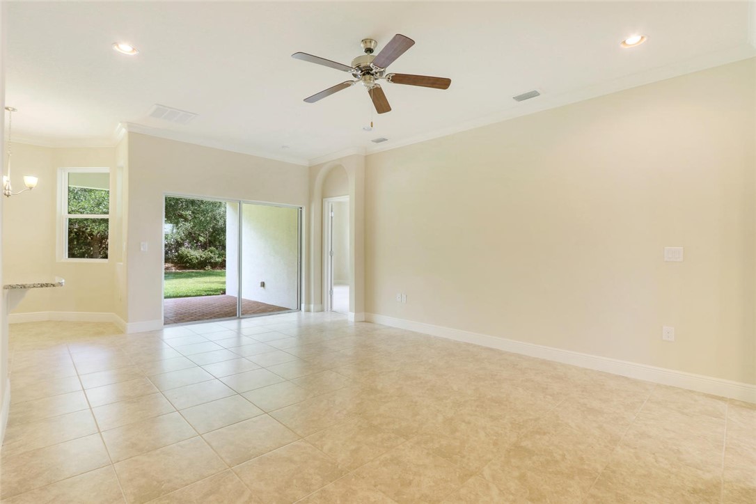 14 52nd Square Vero Beach, FL 32968 - Photo 5 of 25 an empty room with fan and windows