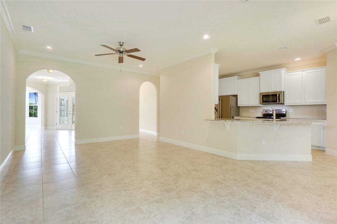 14 52nd Square Vero Beach, FL 32968 - Photo 6 of 25 a view of kitchen with cabinets and wooden floor