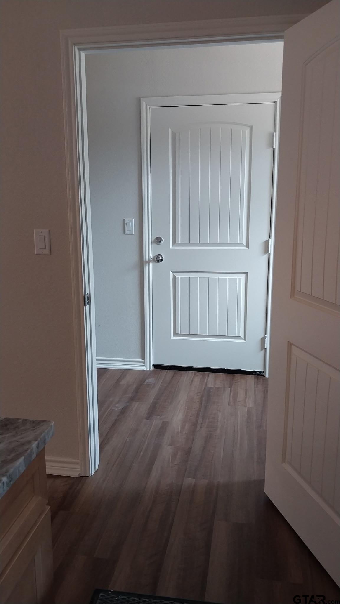 1262 George Richey Road Gladewater, TX 75647 - Photo 17 of 22 an empty room with wooden floor and closet
