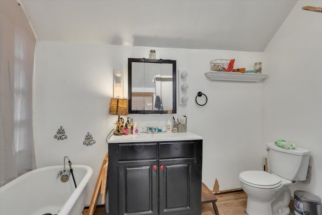 4 Stage Road Huntington, MA 01050 - Photo 12 of 32 a bathroom with a sink vanity mirror and toilet