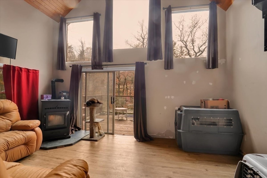 4 Stage Road Huntington, MA 01050 - Photo 15 of 32 a living room with furniture and a flat screen tv