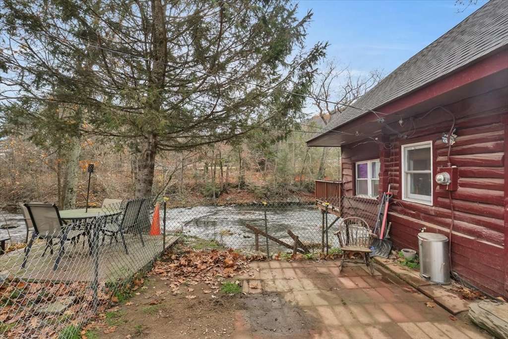 4 Stage Road Huntington, MA 01050 - Photo 5 of 32 a view of a patio with table and chairs and wooden fence