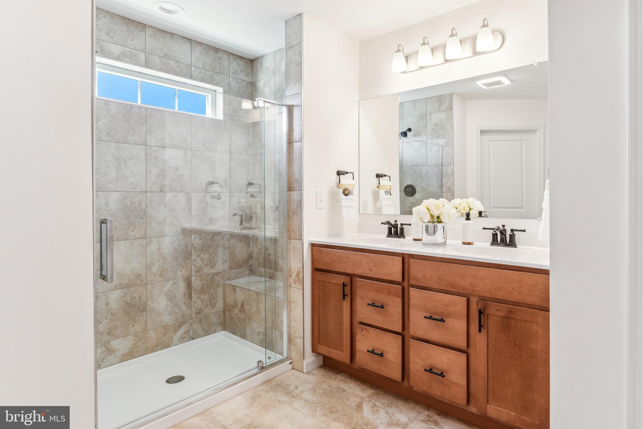 2601 Village Road Dover, PA 17315 - Photo 15 of 20 a bathroom with a shower a sink and a mirror