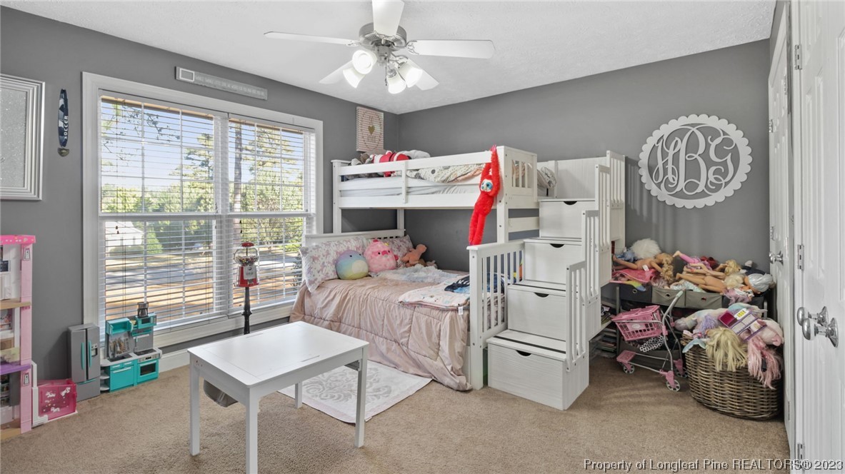185 Russet Court Carthage, NC 28327 - Photo 11 of 32 a bedroom with a bed and a large window