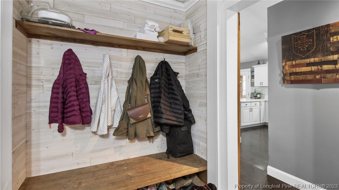 185 Russet Court Carthage, NC 28327 - Photo 21 of 32 a view of walk in closet with clothes and shoes