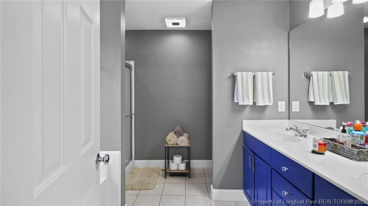 185 Russet Court Carthage, NC 28327 - Photo 24 of 32 a bathroom with a sink toilet and mirror