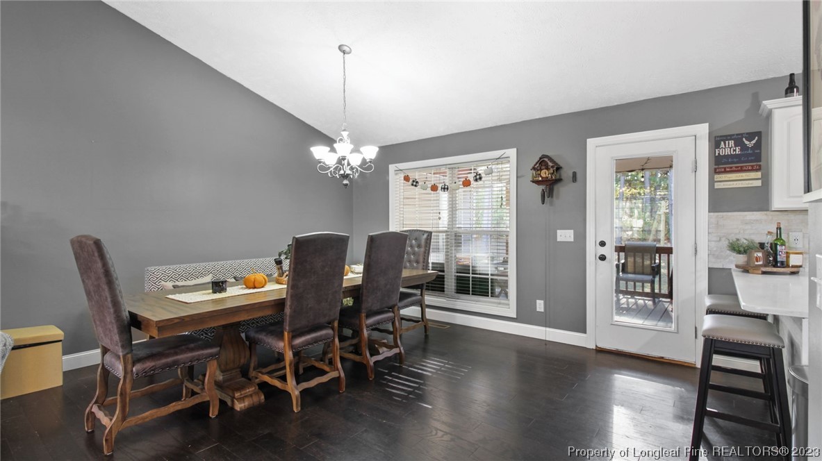 185 Russet Court Carthage, NC 28327 - Photo 6 of 32 a view of a dining room with furniture and wooden floor