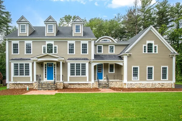 front view of a house with a yard