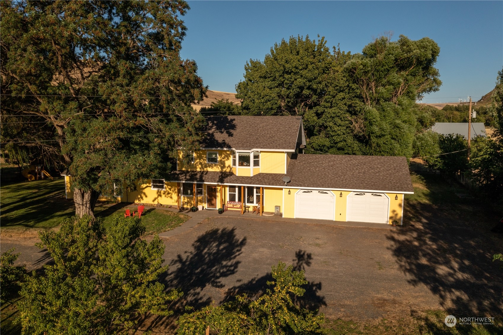 216 Tucannon Road Dayton, WA 99328 - Photo 1 of 39 an aerial view of a house with a yard and lake view