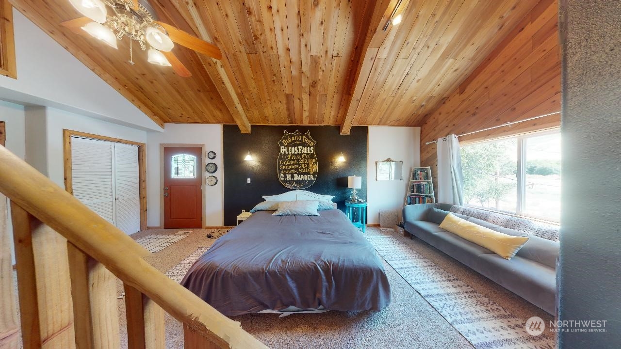 216 Tucannon Road Dayton, WA 99328 - Photo 15 of 39 a spacious bedroom with a large bed and windows