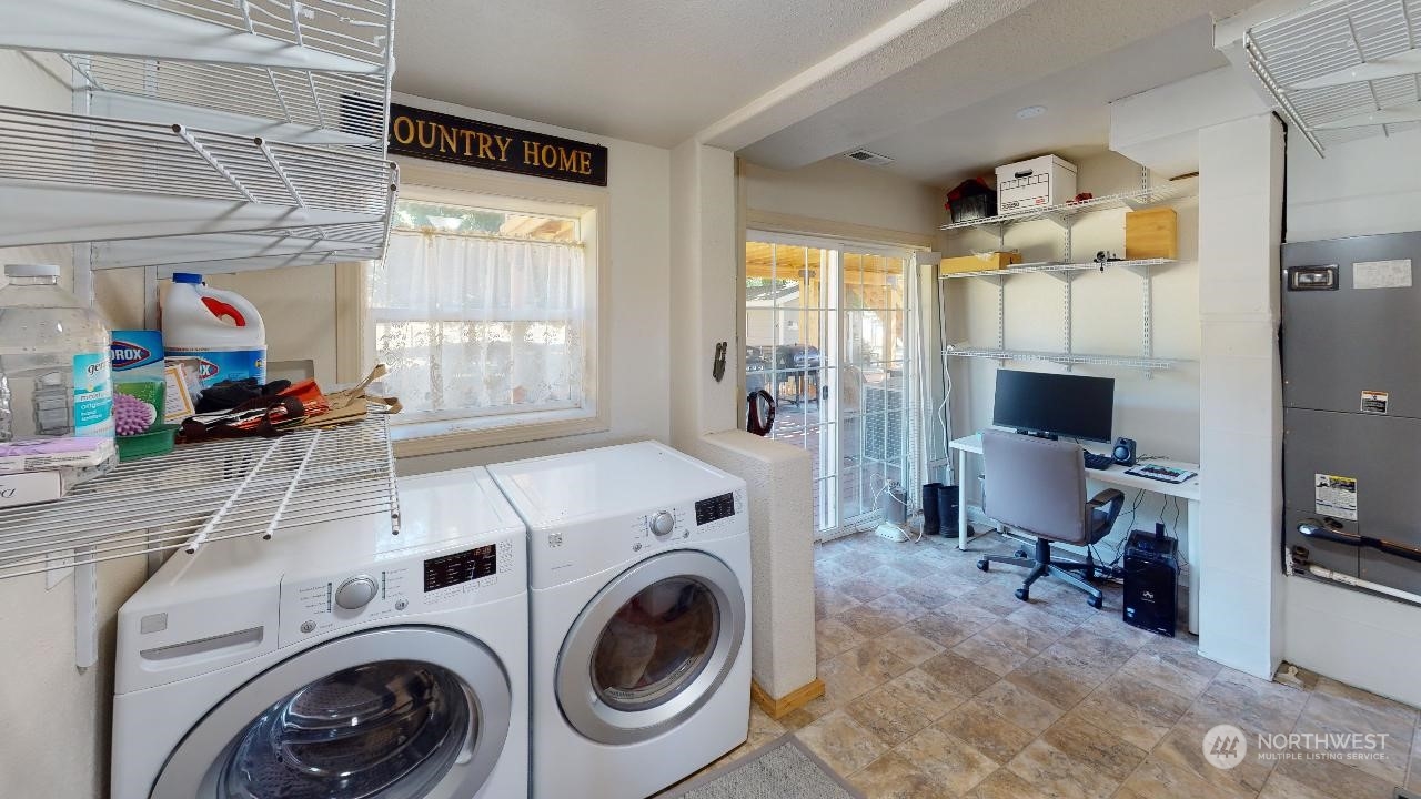 216 Tucannon Road Dayton, WA 99328 - Photo 21 of 39 a view of washer and dryer in a utility room