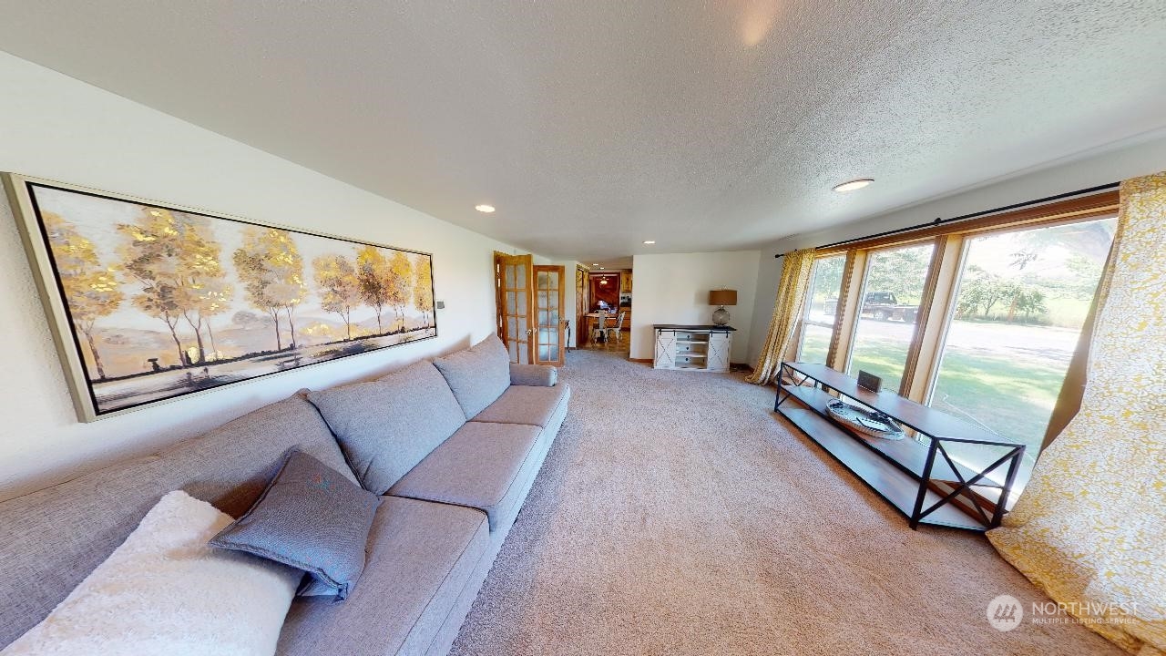 216 Tucannon Road Dayton, WA 99328 - Photo 23 of 39 a living room with furniture and a large window