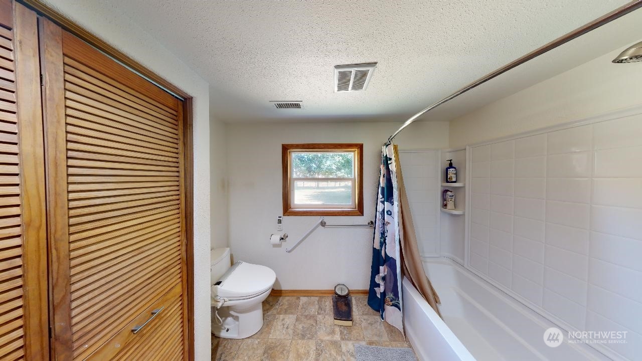 216 Tucannon Road Dayton, WA 99328 - Photo 24 of 39 a bathroom with a toilet sink and a shower