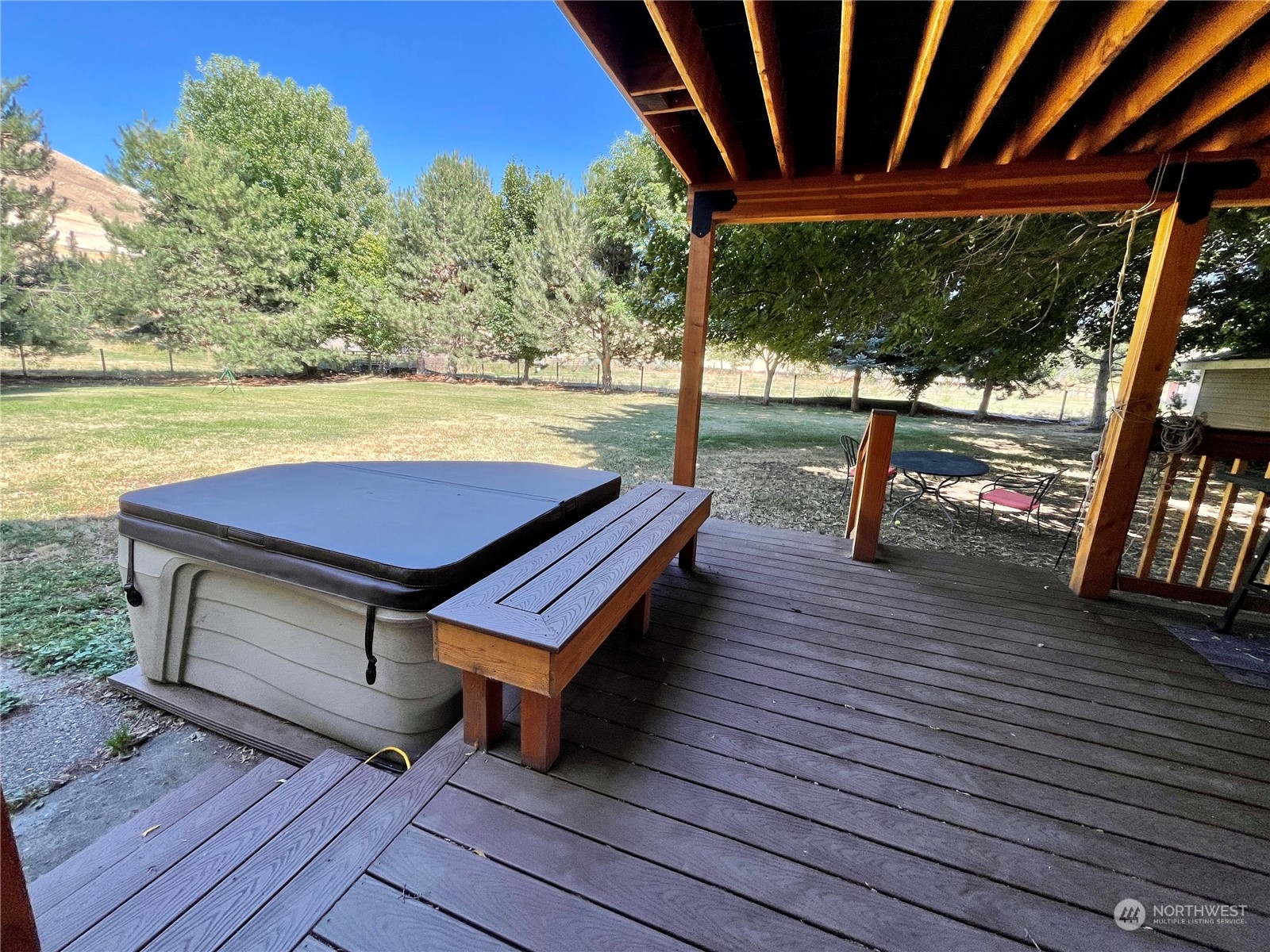 216 Tucannon Road Dayton, WA 99328 - Photo 36 of 39 a wooden bench sitting on top of a wooden deck